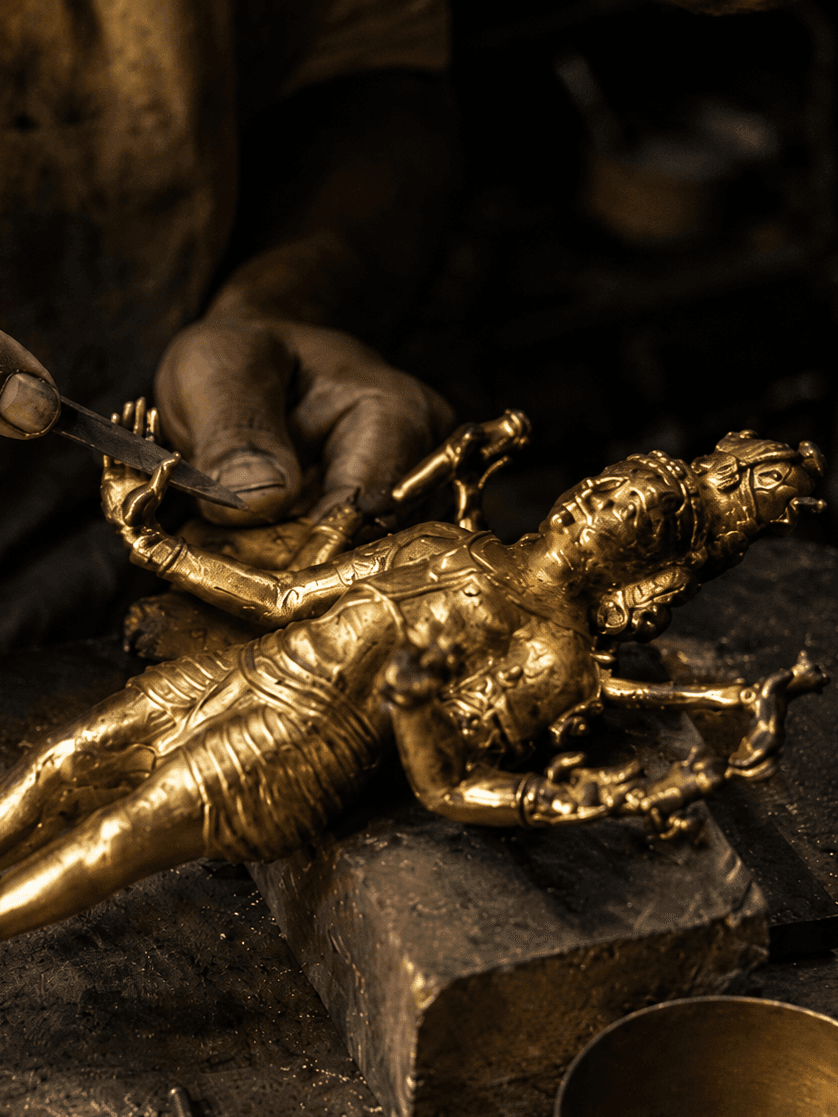 Artisan crafting brass artifacts